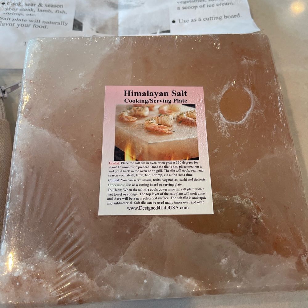 Himalayan salt cooking plate new, great gift for foodie with dinner ingredients.